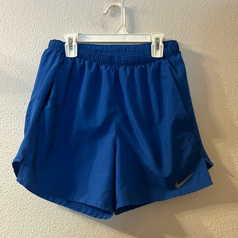 Nike blue running shorts with pocket in back
